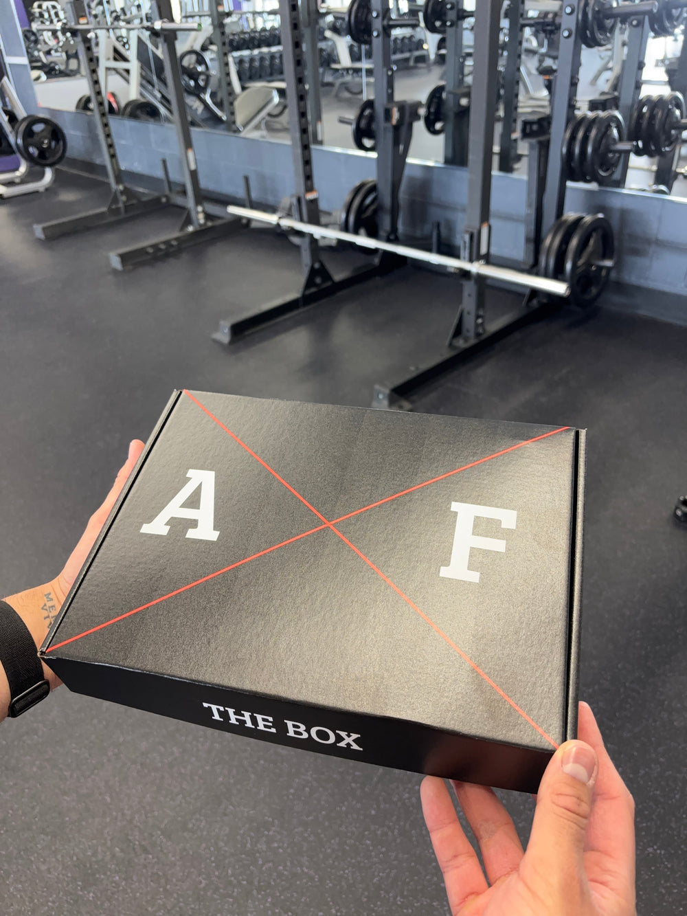 Original photograph of the closed black AXF The Box held in a gym